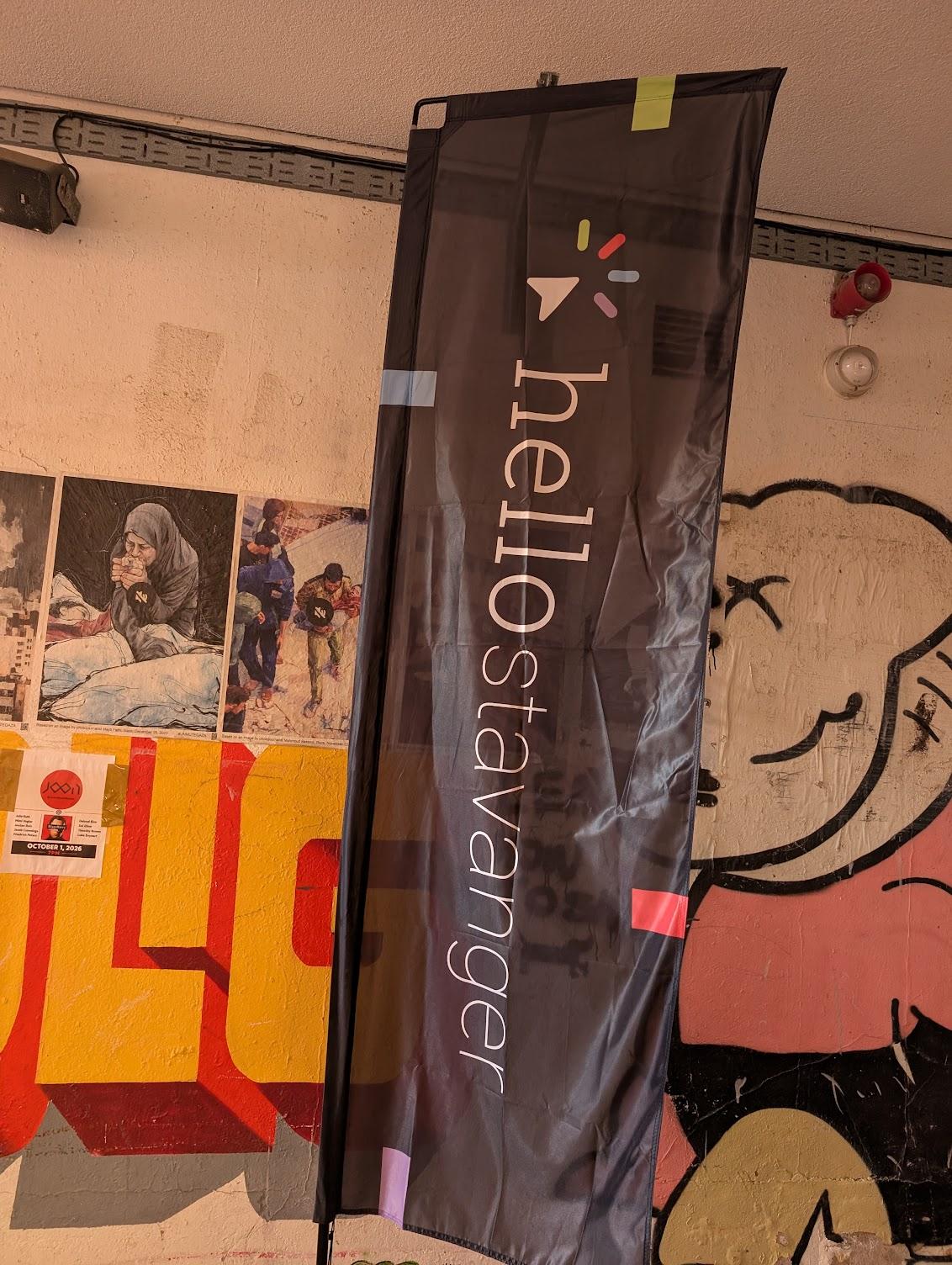 Hello Stavanger banner in front of a graffiti mural
