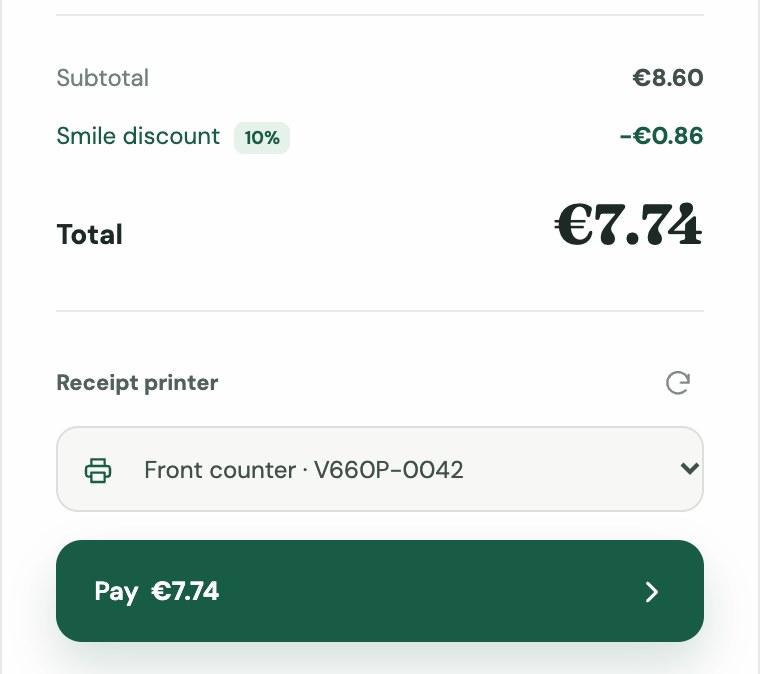 The Smile Coffee order panel: subtotal €8.60, smile discount −€0.86, total €7.74, a V660p selected as the receipt printer, and a Pay €7.74 button