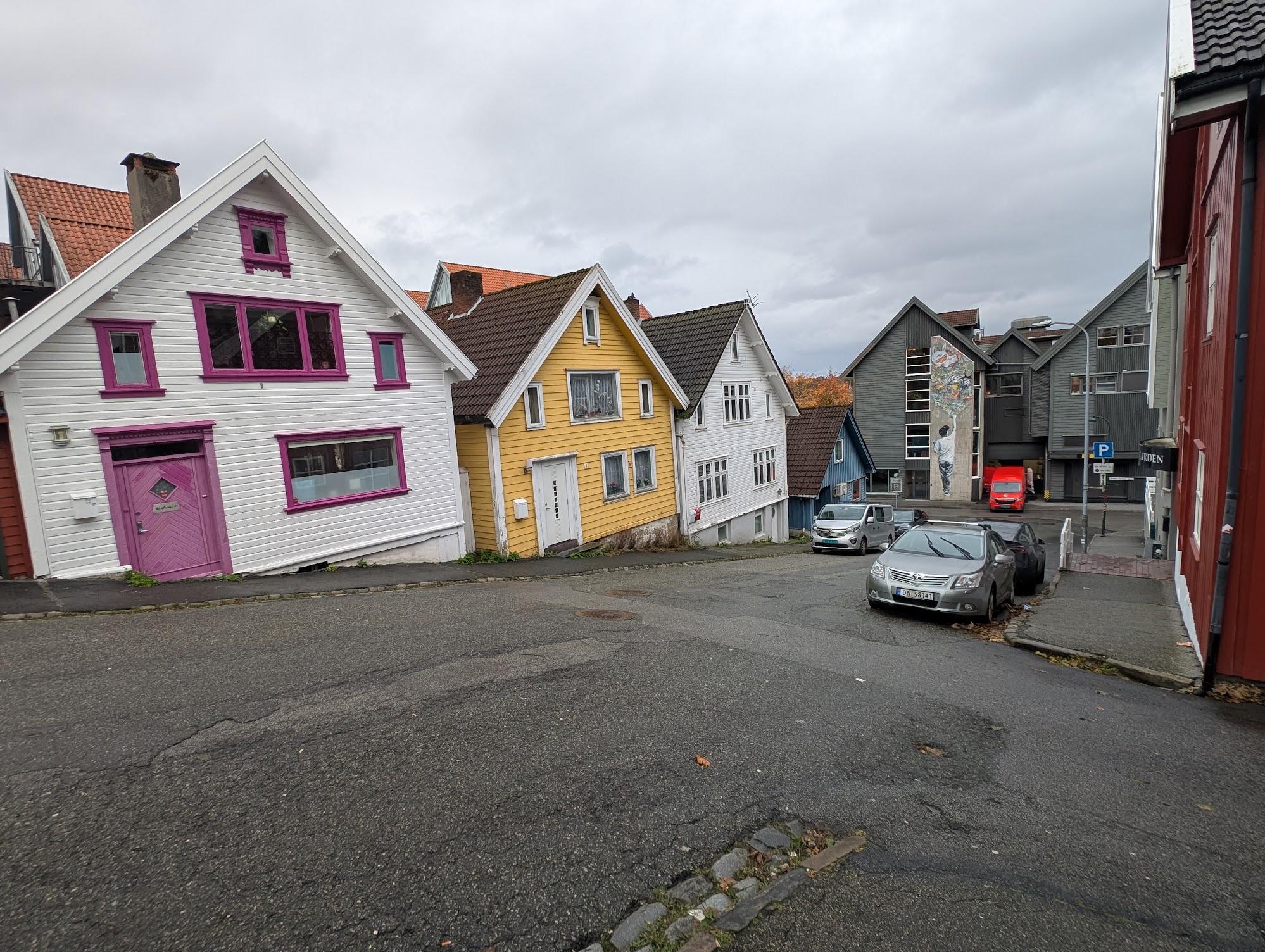 Colourful wooden houses on a sloping street