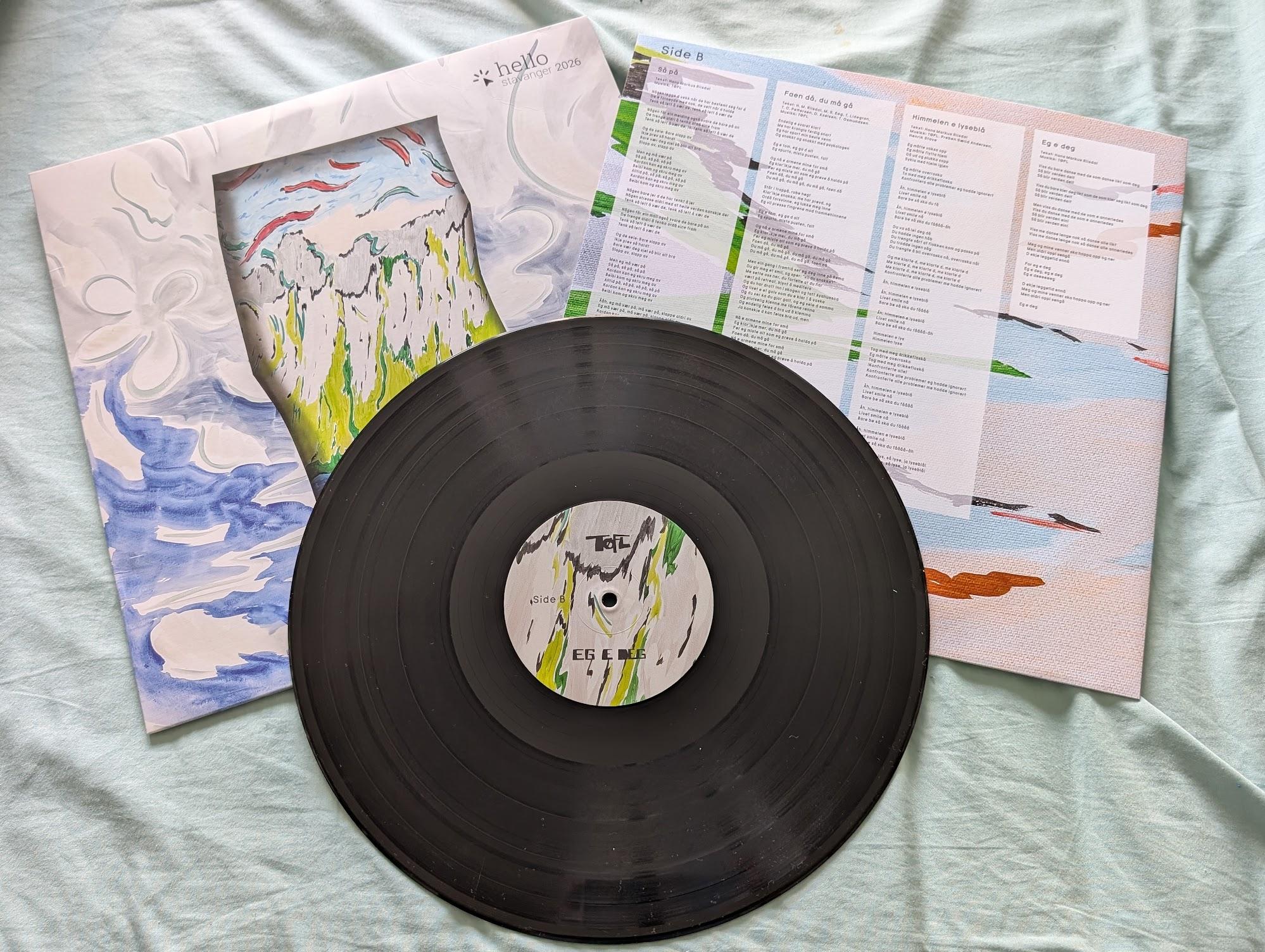 TØFL vinyl record with its sleeve and lyric insert, cover art by Ingrid Toogood
